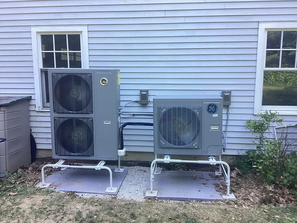 Heat pumps outside of residential home in Franklin, MA