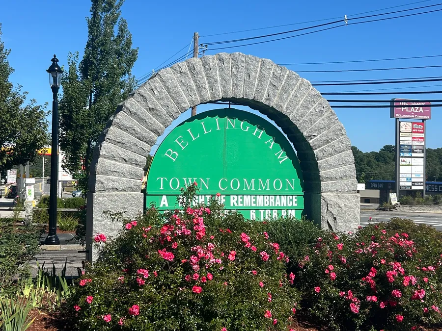 Bellingham Town Common sign and rose bushes in Bellingham, MA.