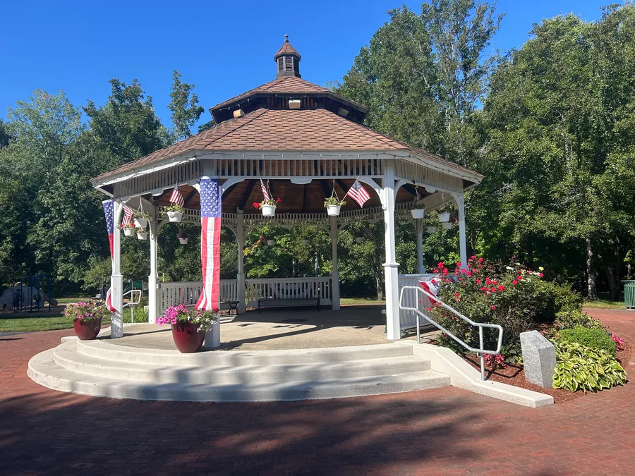 Gazebo decorated with American flags on the Bellingham Town Common in Bellingham, MA.