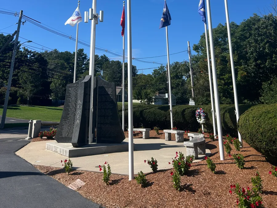 Veterans memorial and flagpoles in Bellingham, MA.