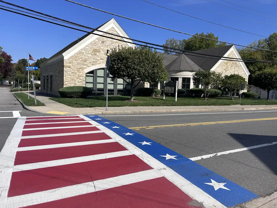Red, white and blue crosswalk near the Blackstone Public Library in Blackstone, MA.