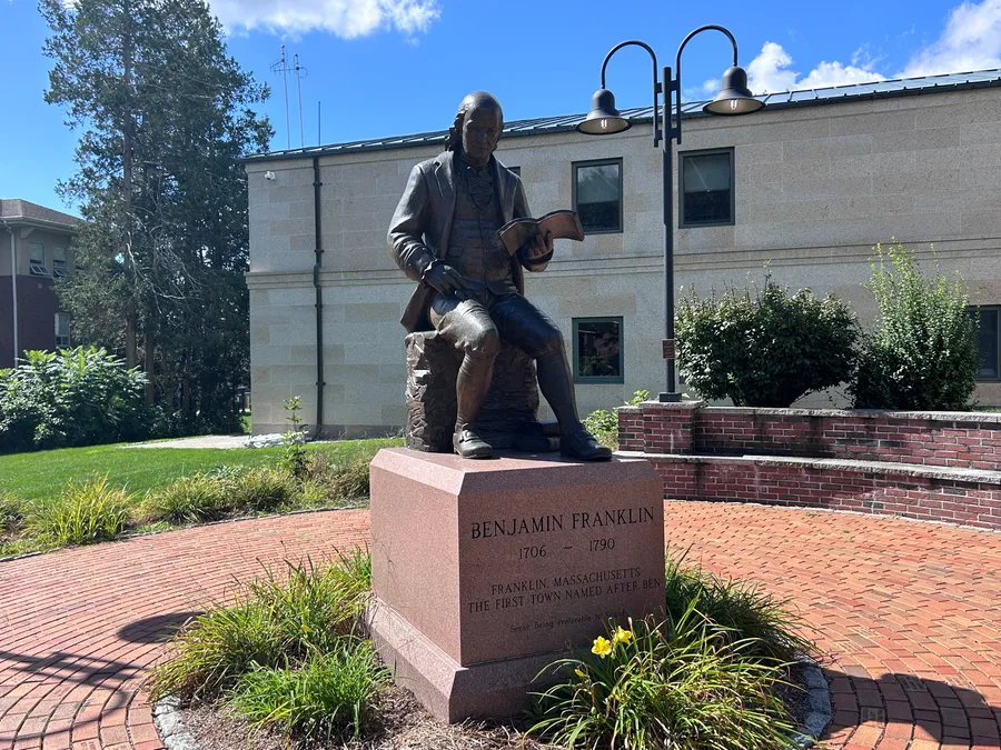 Benjamin Franklin statue outside Franklin Public Library in Franklin, MA.