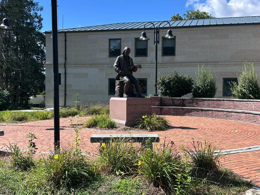 Benjamin Franklin statue outside Franklin Public Library in Franklin, MA.