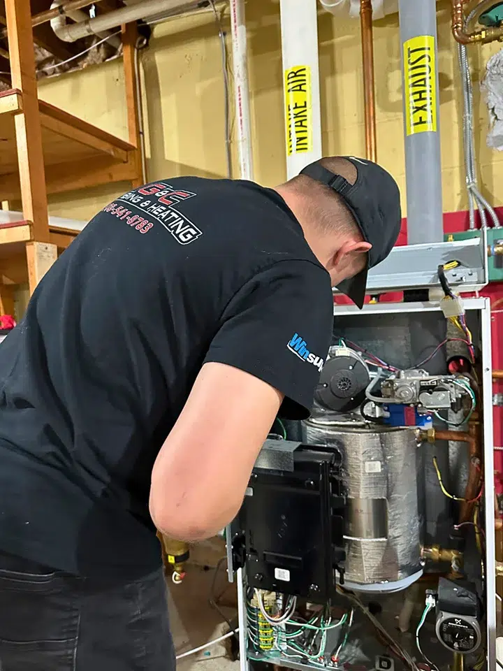 tech working on a boiler