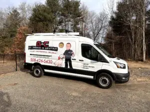 G&C Plumbing and Heating truck parked outside in wooded area of Franklin, MA.